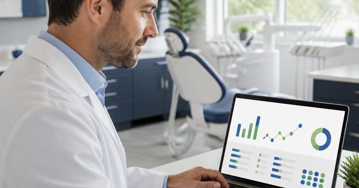 Dentist reviewing search performance data on a laptop in a dental practice.